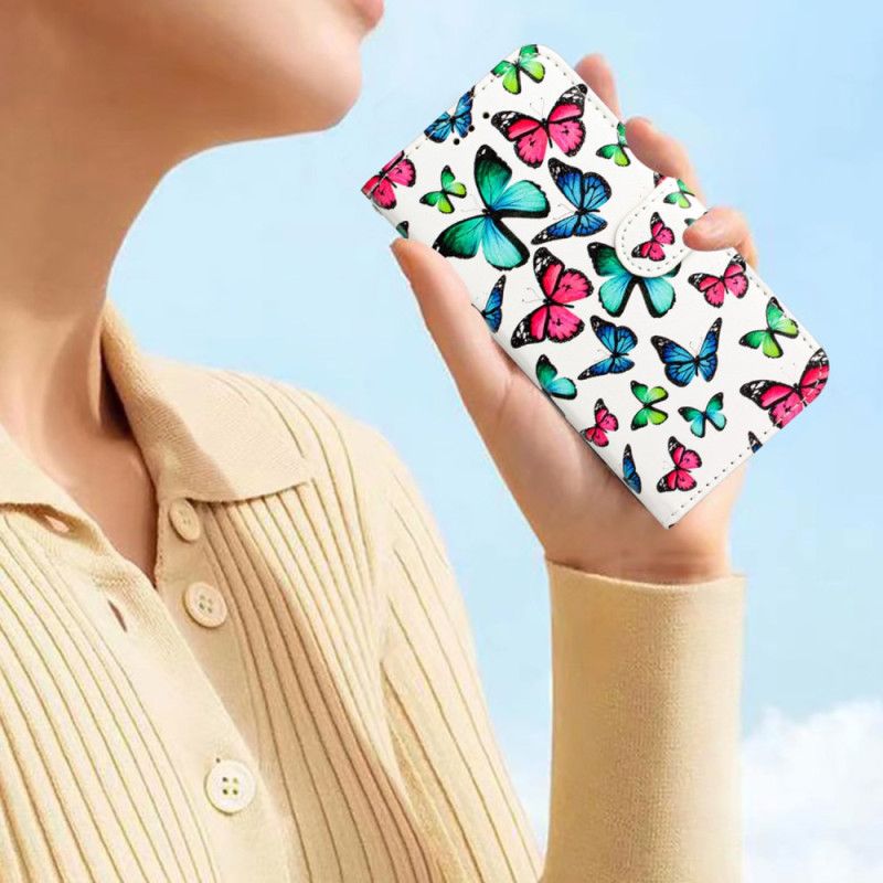 Kožené Puzdro Xiaomi Redmi A1 Motýle V Lete S Popruhom