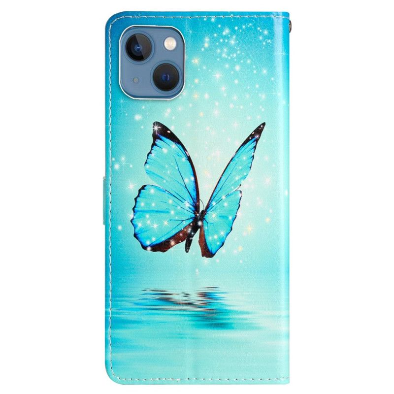 Kožené Puzdro iPhone 15 Modrý Motýľ V Lete S Popruhom